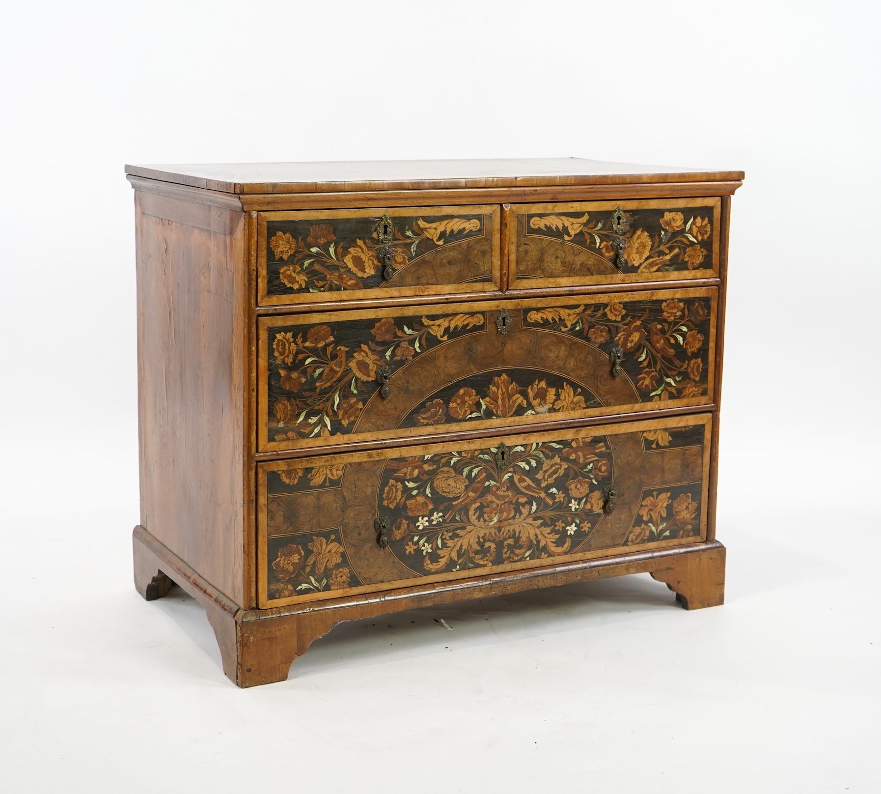 A William & Mary and later floral marquetry inlaid walnut chest